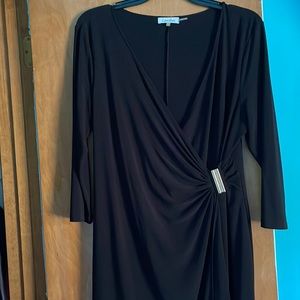 Calvin Klein black wrap dress with gold clasp on waist.
